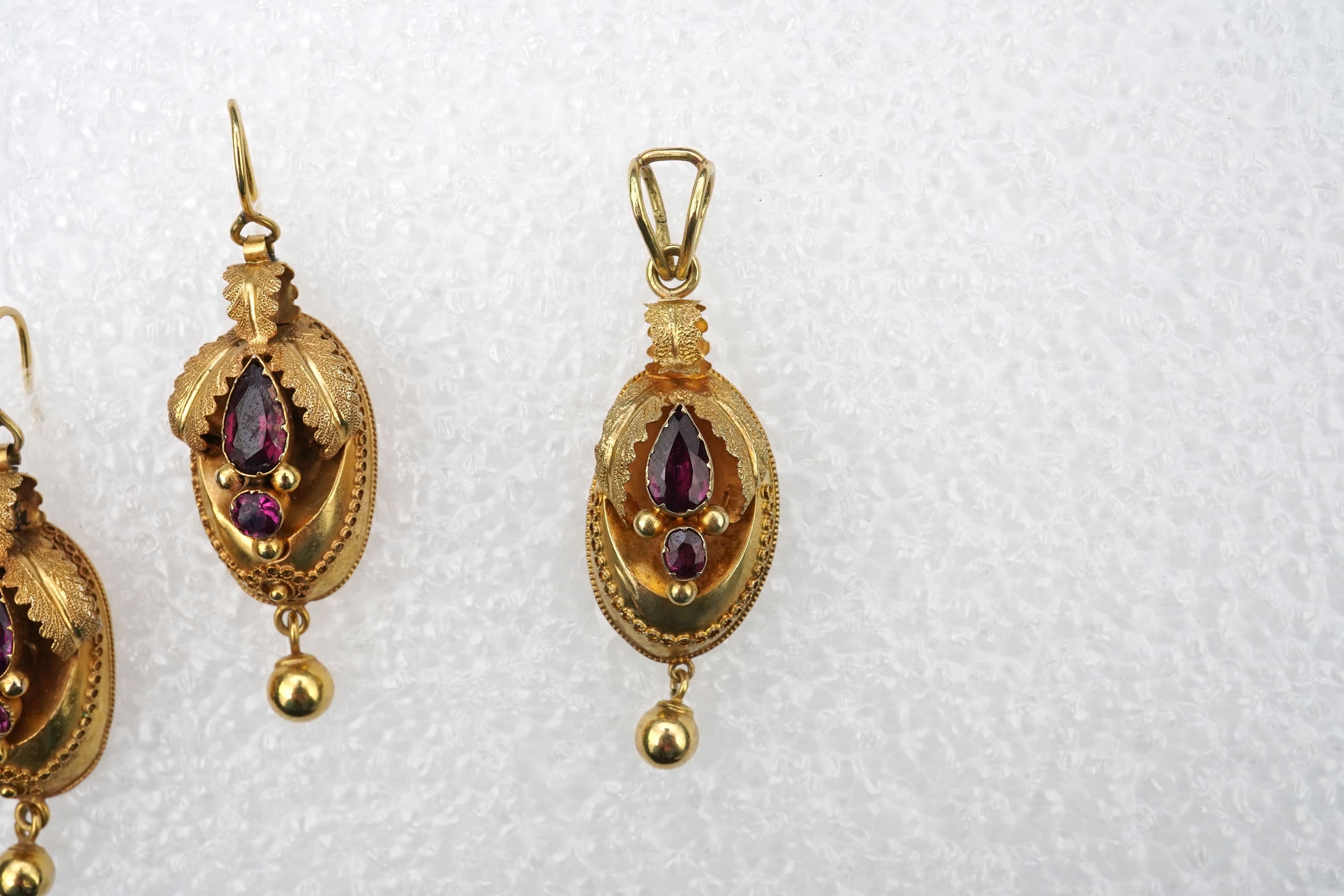 A Victorian gold and garnet demi-parure, mid 19th century